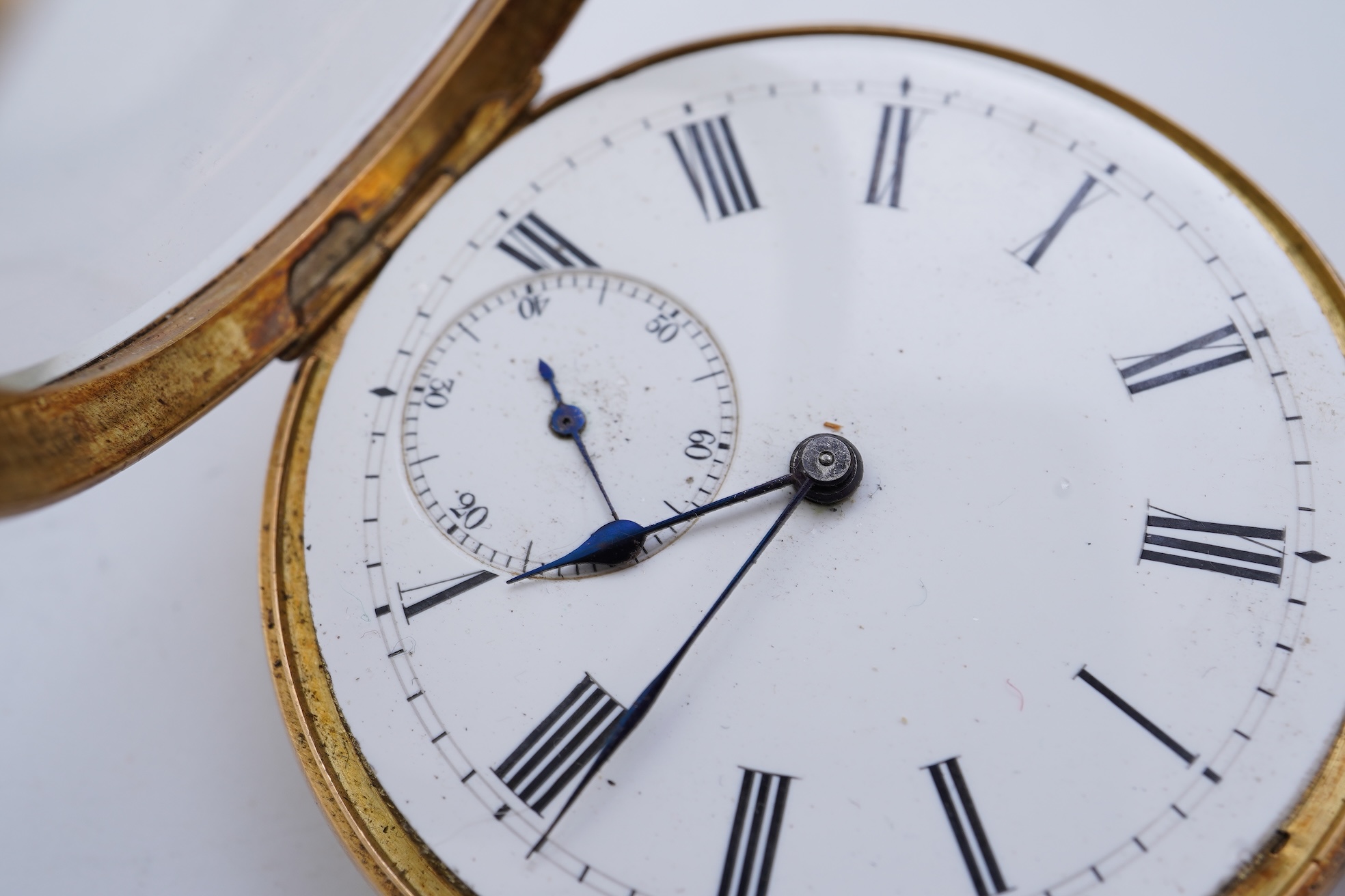 A continental 18k gold open faced keyless lever pocket watch, with a 9ct albert
